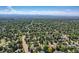 Scenic aerial view of the neighborhood, featuring tree-lined streets and well-maintained properties at 3695 E Dartmouth Ave, Denver, CO 80210