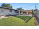 Landscaped backyard with well-maintained lawn and patio, ideal for outdoor entertaining at 3695 E Dartmouth Ave, Denver, CO 80210