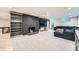 Finished basement features a stone fireplace, built-in shelves, and a comfortable seating area at 3695 E Dartmouth Ave, Denver, CO 80210