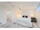 Basement bedroom with wall to wall carpet and bedside table featuring a reading lamp at 3695 E Dartmouth Ave, Denver, CO 80210