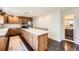 Well-equipped kitchen featuring a center island, stainless steel appliances, and ample counter space at 3695 E Dartmouth Ave, Denver, CO 80210