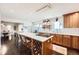 Spacious kitchen with a large island, stainless steel appliances, and plenty of cabinet space at 3695 E Dartmouth Ave, Denver, CO 80210