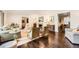 Elegant living room showcasing hardwood floors, a fireplace, and stylish furnishings at 3695 E Dartmouth Ave, Denver, CO 80210