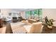 Bright living room features large windows, comfortable seating, and stylish decor at 3695 E Dartmouth Ave, Denver, CO 80210