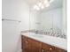 Bathroom featuring modern vanity, mosaic tile backsplash and bright overhead lighting at 4073 S Liverpool St, Aurora, CO 80013