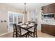 Dining room featuring a dark wood table and view of the sliding glass doors at 4073 S Liverpool St, Aurora, CO 80013