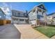 Stunning exterior view of a two-story home showcasing a well-manicured lawn, multi-car garage, and charming porch at 4073 S Liverpool St, Aurora, CO 80013