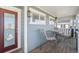 Inviting front porch with a seating area and a charming neighborhood view at 4073 S Liverpool St, Aurora, CO 80013