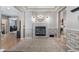 Cozy living room featuring a modern fireplace, decorative mirror, and elegant wall trim at 4073 S Liverpool St, Aurora, CO 80013