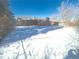 Snowy backyard view of home's exterior at 1120 Tucson St, Aurora, CO 80011