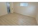 Bedroom with hardwood floors and access to bathroom at 1120 Tucson St, Aurora, CO 80011