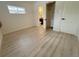 Bedroom with hardwood floors and private bathroom access at 1120 Tucson St, Aurora, CO 80011