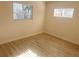 This bedroom has a new vinyl floor and lots of natural light at 1120 Tucson St, Aurora, CO 80011