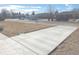 Newly paved driveway with views of the neighborhood at 1120 Tucson St, Aurora, CO 80011