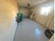 Spacious garage with epoxy flooring, a garage door, and clean, neutral-colored walls at 1120 Tucson St, Aurora, CO 80011