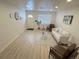 Bright living room with new laminate floors, neutral walls, and plenty of natural light at 1120 Tucson St, Aurora, CO 80011