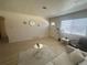 Bright living room with new laminate floors, neutral walls, and plenty of natural light at 1120 Tucson St, Aurora, CO 80011