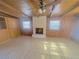 Living room features a fireplace and wood paneled walls at 1120 Tucson St, Aurora, CO 80011