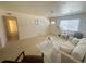 Light and airy living room with hardwood floors and large windows at 1120 Tucson St, Aurora, CO 80011