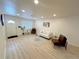 Bright living room with new laminate floors, neutral walls, and plenty of natural light at 1120 Tucson St, Aurora, CO 80011