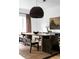 Elegant dining room featuring a wood table and statement lighting at 3422 S Grant St, Englewood, CO 80113