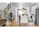 Open concept kitchen with white cabinets, island, and hardwood floors at 3422 S Grant St, Englewood, CO 80113