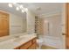 Bathroom featuring a single sink vanity, toilet and tub with shower at 13952 E Marina Dr # 102, Aurora, CO 80014