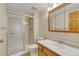 Bathroom featuring a glass enclosed shower, single sink vanity and toilet at 13952 E Marina Dr # 102, Aurora, CO 80014