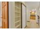 Hallway featuring closet with shelving and tile floor at 13952 E Marina Dr # 102, Aurora, CO 80014