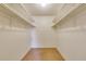 Walk-in closet provides ample storage space with built-in shelving at 13952 E Marina Dr # 102, Aurora, CO 80014