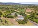 Stunning aerial view of the property surrounded by trees and offering mountain views at 2357 Oak Ridge Rd, Sedalia, CO 80135