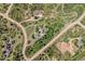 Aerial view showcases the property's location, surrounded by lush greenery and natural beauty at 2357 Oak Ridge Rd, Sedalia, CO 80135