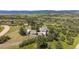 Gorgeous aerial view of the property showcasing the home, surrounding landscape, and rolling hills at 2357 Oak Ridge Rd, Sedalia, CO 80135