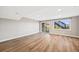 Bright basement includes a sliding glass door leading to the outside and updated flooring at 2357 Oak Ridge Rd, Sedalia, CO 80135