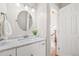 Elegant bathroom with marble countertop, modern fixtures, and a view into the hallway at 2357 Oak Ridge Rd, Sedalia, CO 80135