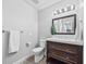 Updated bathroom with modern vanity, lighting, and fixtures at 2357 Oak Ridge Rd, Sedalia, CO 80135