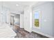 Bright bathroom featuring marble countertops and luxury vinyl tile flooring that leads to the Primary bedroom at 2357 Oak Ridge Rd, Sedalia, CO 80135