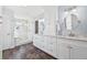 Bright, updated bathroom featuring a double sink vanity, white cabinets, and a large walk-in shower at 2357 Oak Ridge Rd, Sedalia, CO 80135