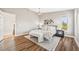 Inviting bedroom with hardwood floors, a ceiling fan, a large bed, and lots of natural light at 2357 Oak Ridge Rd, Sedalia, CO 80135