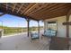 Relaxing deck area, perfect for enjoying views and outdoor living, with comfortable seating and a wooden ceiling at 2357 Oak Ridge Rd, Sedalia, CO 80135