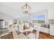Bright dining area with scenic views, stylish lighting, and comfortable seating at 2357 Oak Ridge Rd, Sedalia, CO 80135