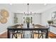 Bright dining room features a table set for six and a large window offering scenic outdoor views at 2357 Oak Ridge Rd, Sedalia, CO 80135