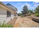 Exterior showcases a stone patio and walkway leading to the home's side entrance at 2357 Oak Ridge Rd, Sedalia, CO 80135