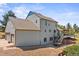 Back exterior view featuring a deck, stairs, and a pergola-covered seating area at 2357 Oak Ridge Rd, Sedalia, CO 80135