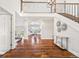 Elegant foyer with hardwood floors, staircase with iron railing, and views to living areas at 2357 Oak Ridge Rd, Sedalia, CO 80135