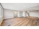 Living room with hardwood floors, neutral walls, recessed lighting, and a staircase at 2357 Oak Ridge Rd, Sedalia, CO 80135