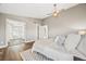 This spacious bedroom features hardwood floors and has an open view into the luxurious bathroom at 2357 Oak Ridge Rd, Sedalia, CO 80135