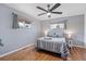 Bedroom with wood floors, neutral paint, ceiling fan, and a window with natural light at 3700 Miller St, Wheat Ridge, CO 80033