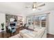 Cozy living room features a stone fireplace and large windows at 3700 Miller St, Wheat Ridge, CO 80033