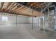 Spacious unfinished basement with exposed beams and utilities, ready for customization and future development at 5584 Turnbury Cir, Elizabeth, CO 80107